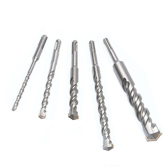 Two-groove, two-slot round shank hammer drill bit for enlarging holes in cement concrete through walls.