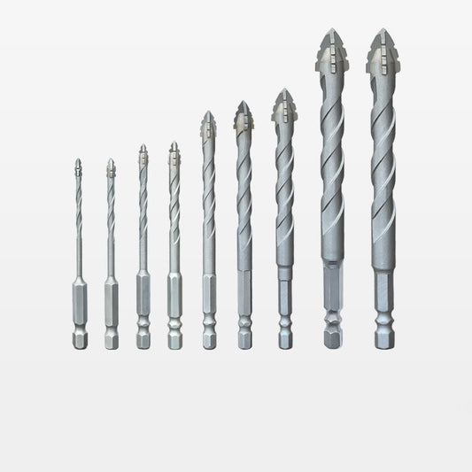 Dry drilling of ceramic tiles, glass, marble, and concrete with serrated drill bits and super hard alloys